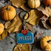 Acryl-Schlüsselanhänger "Pflege" mit Herz