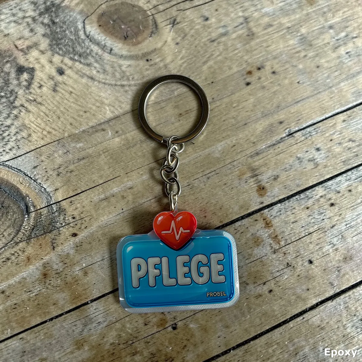 Acryl-Schlüsselanhänger "Pflege" mit Herz