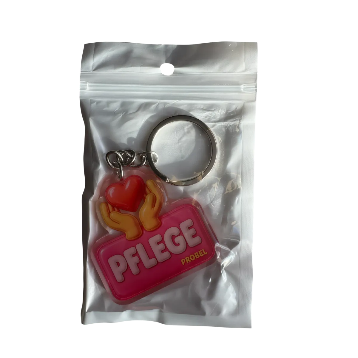 Acryl-Schlüsselanhänger "Pflege" mit Herz und Händen