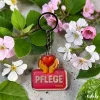 Acryl-Schlüsselanhänger "Pflege" mit Herz und Händen