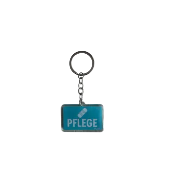 Acryl-Schlüsselanhänger "Pflege" mit Pflaster-Symbol