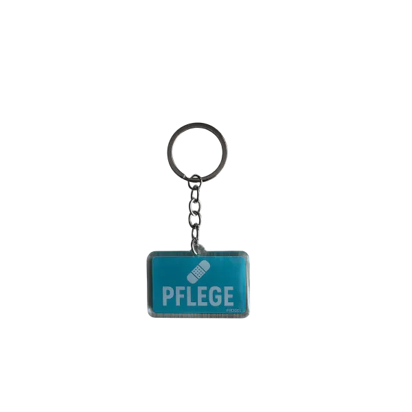 Acryl-Schlüsselanhänger "Pflege" mit Pflaster-Symbol