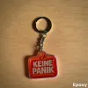 Akrylový přívěsek "KEINE PANIK"