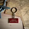 Stoff-Schlüsselanhänger „REMOVE BEFORE FLIGHT“