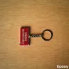 Stoff-Schlüsselanhänger „REMOVE BEFORE FLIGHT“