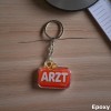Акриловый брелок ARZT (красный со стетоскопом)