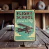 Kovová cedule "Flight School – Learn to Fly"