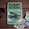 Kovová cedule "Flight School – Learn to Fly"