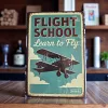 Kovová cedule "Flight School – Learn to Fly"