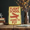 Metallschild Flight School – Learn to Fly (Red Biplane)